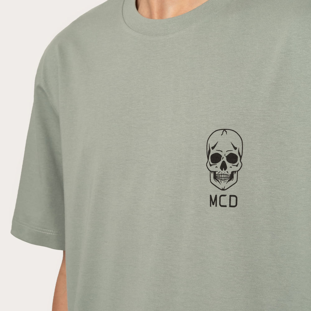 Camiseta Regular MCD Logo Caveira